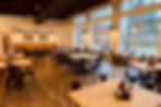 Bright, spacious restaurant interior with tables and chairs