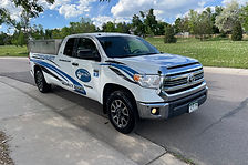 a Secure-All security doors installation truck parked with logos