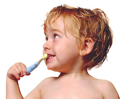 Pediatric dentist explaining brushing techniques to a child