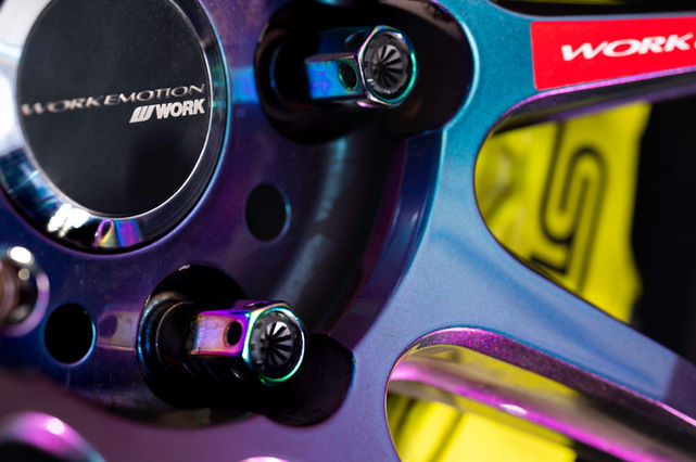 Close-up of a WORK Emotion wheel with WORK text and logo in detail.