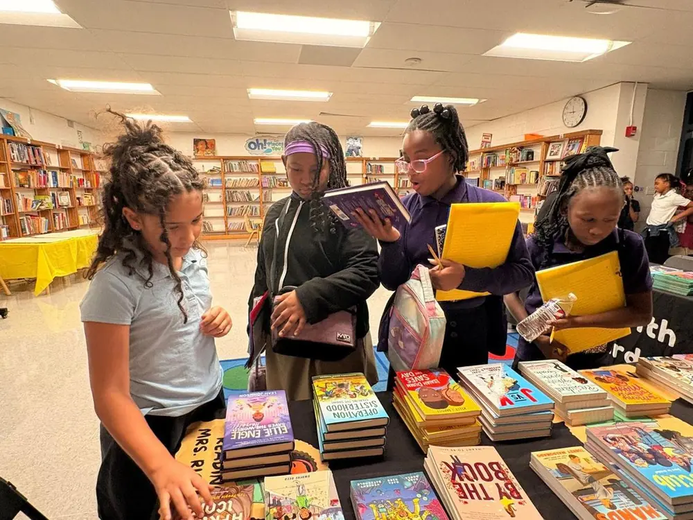 Students choosing new books at Circles of Success