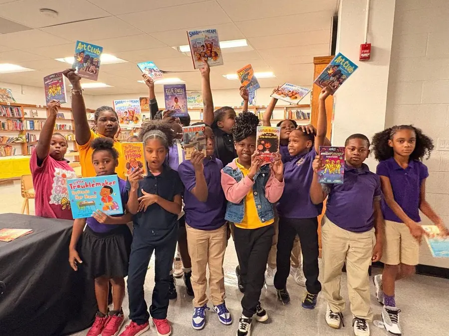 Circles of Success students holding up their new books