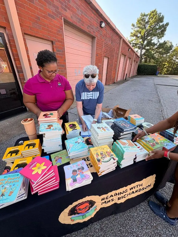 Books set out at a Sweet Cheeks Diaper Ministry community giveaway