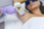 Close-up view of laser device targeting hair follicles on skin