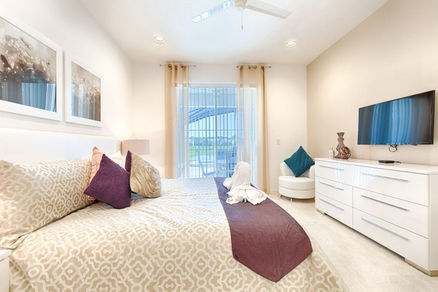 Orlando vacation rental home with two master king bedrooms en-suite with private full bathrooms, TVs, ceiling fan.