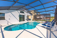Orlando vacation rental home with private screened pool and spa and a water view.