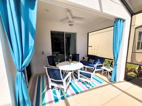 Orlando vacation rental home with private screened patio for outdoor dining.