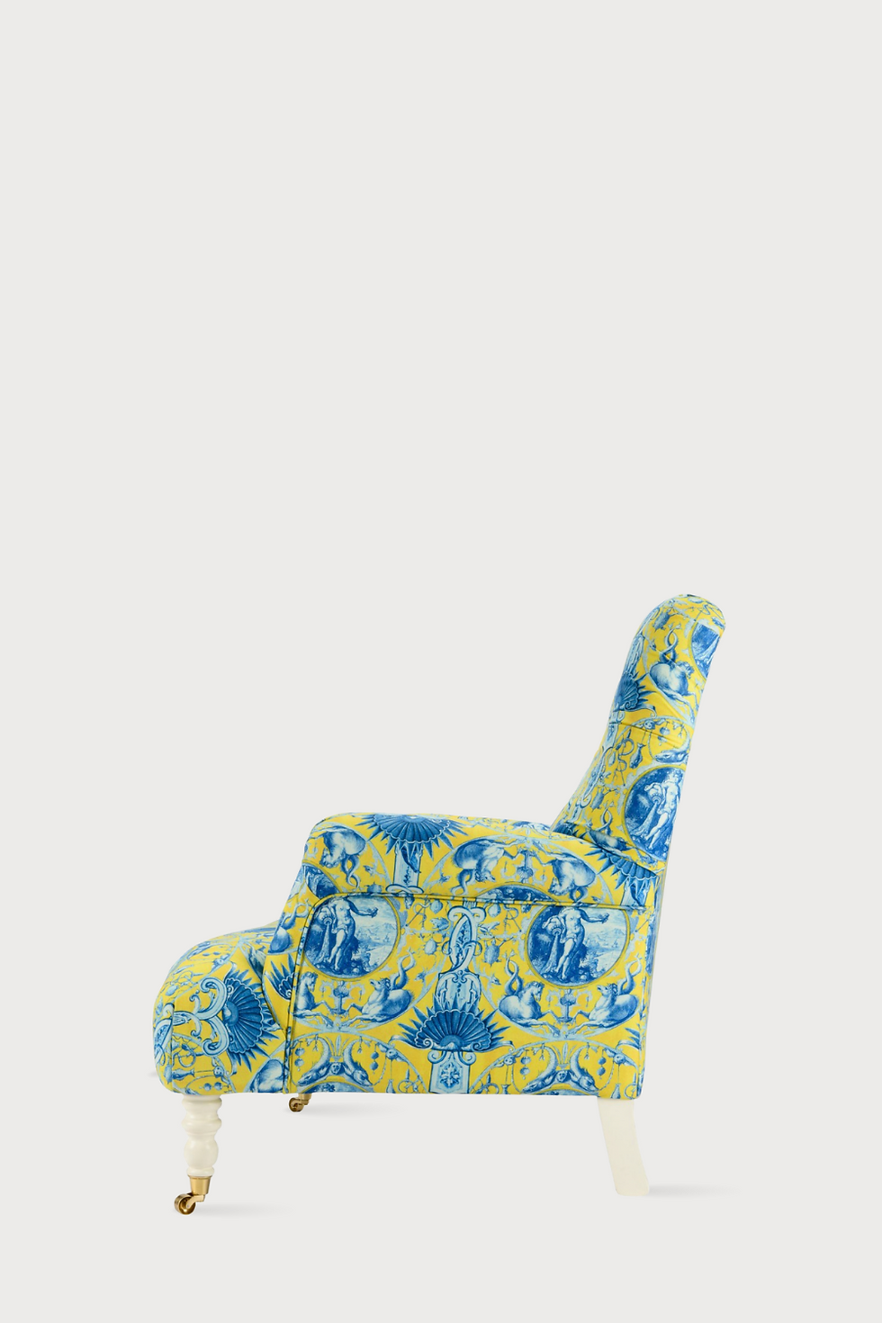 Thumbnail: Seitliche Ansicht eines Sofas von Mind the Gap mit grün-blauem Barockmuster und weißen Beinen mit goldenen Rolle