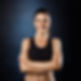 beautiful-sportive-girl-posing-with-crossed-arms-dark-wall 2.jpg