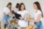 Rainer Philanthropies-smiley-volunteers-preparing-food-donation