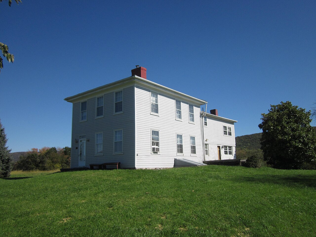 A white ridge house under a clear sky in Jefferson County, West Virginia.