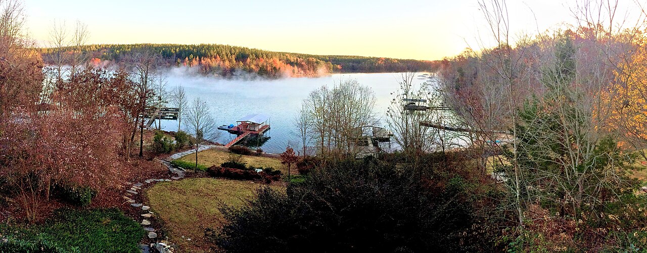 Private docks on Lake Keowee at first light, with mist on the water in South Carolina.