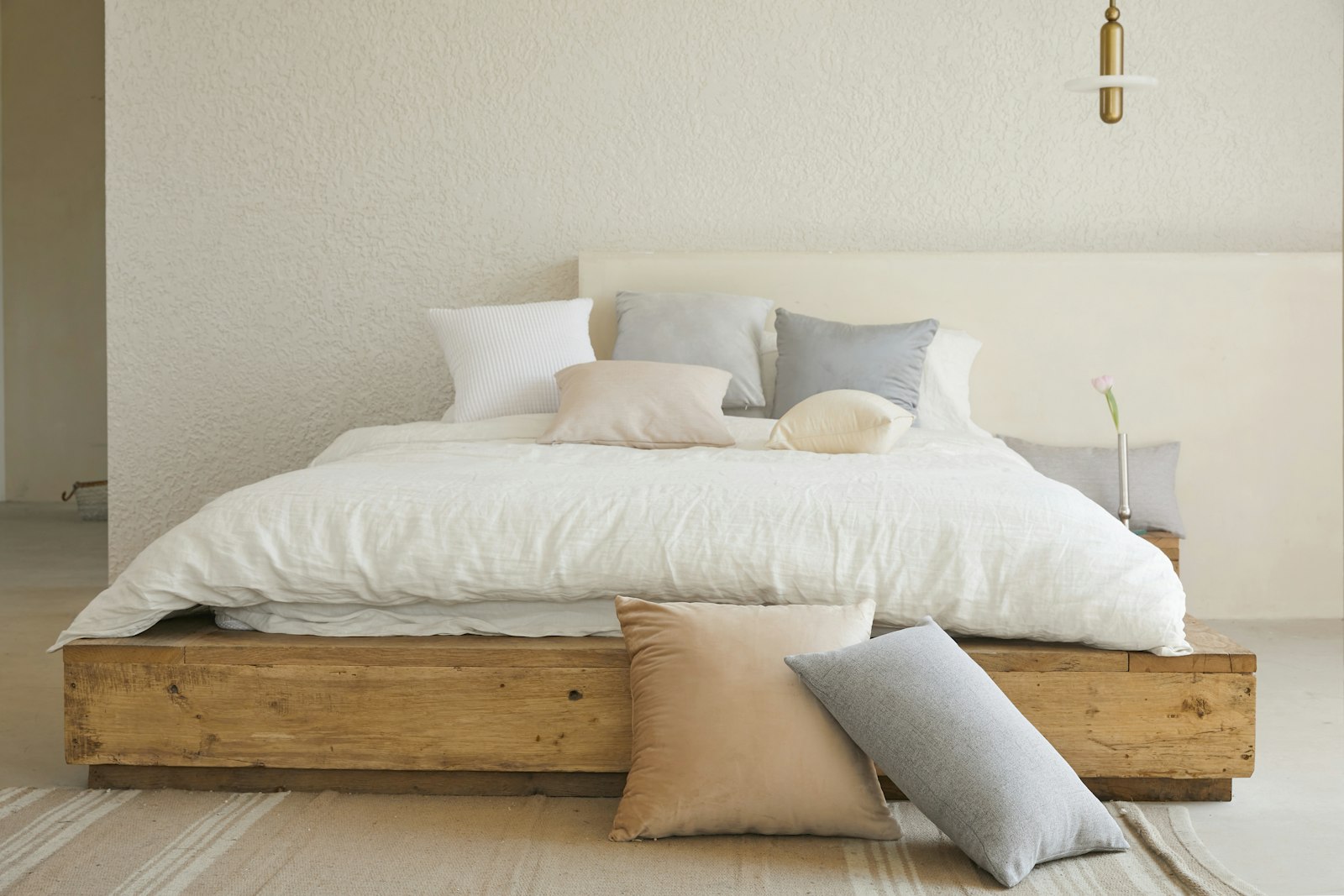 Neutral short-term rental bedroom with linen bedding