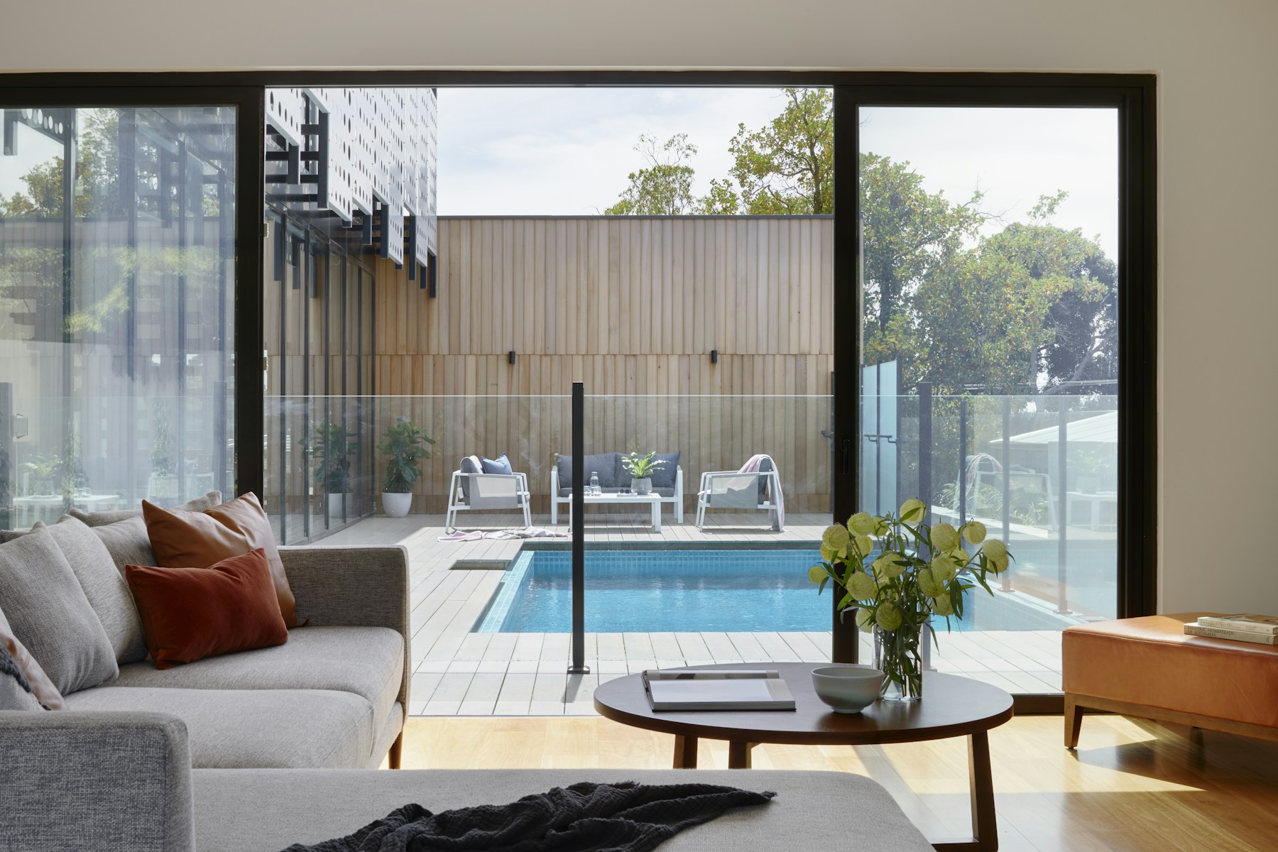 Stay living-room interior toward a pool, no faces