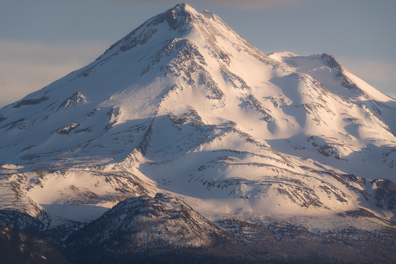 Close view of snow on Mount Shasta and Shastina in winter light