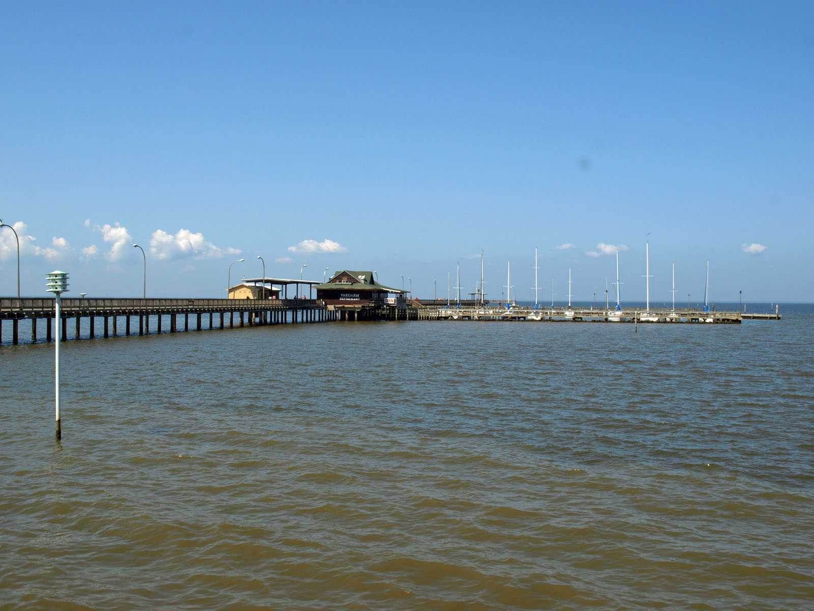 Fairhope Municipal Pier on Mobile Bay under a clear sky