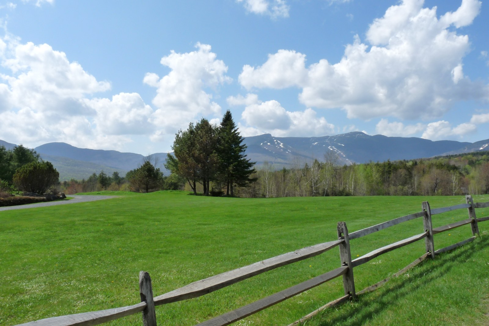 Spring meadow and split-rail fence facing Mount Mansfield from Stowe