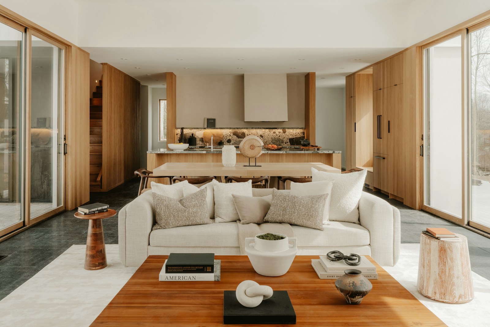 White sofa facing a wood kitchen, no people
