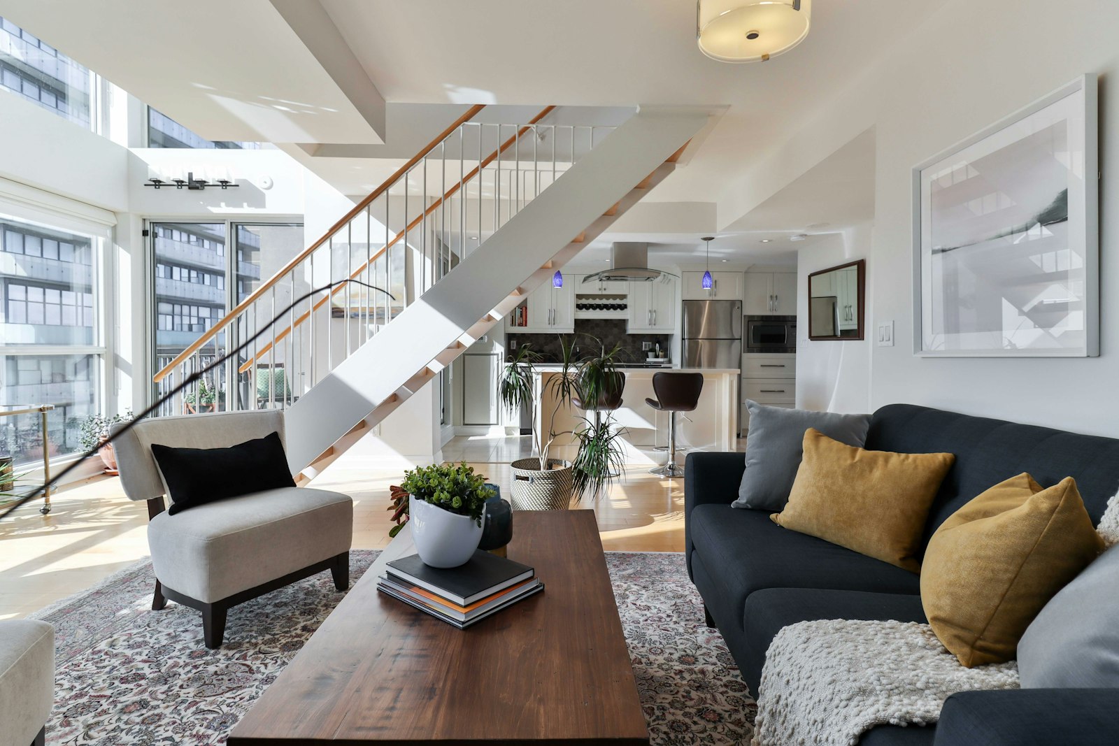 Urban apartment rental loft with a staircase and open kitchen