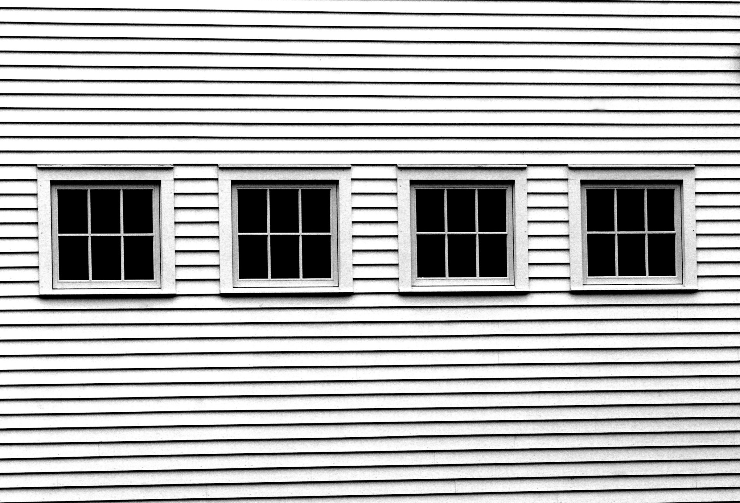 White barn and windows in Woodstock, Vermont. Unsplash photo location-tagged Woodstock.
