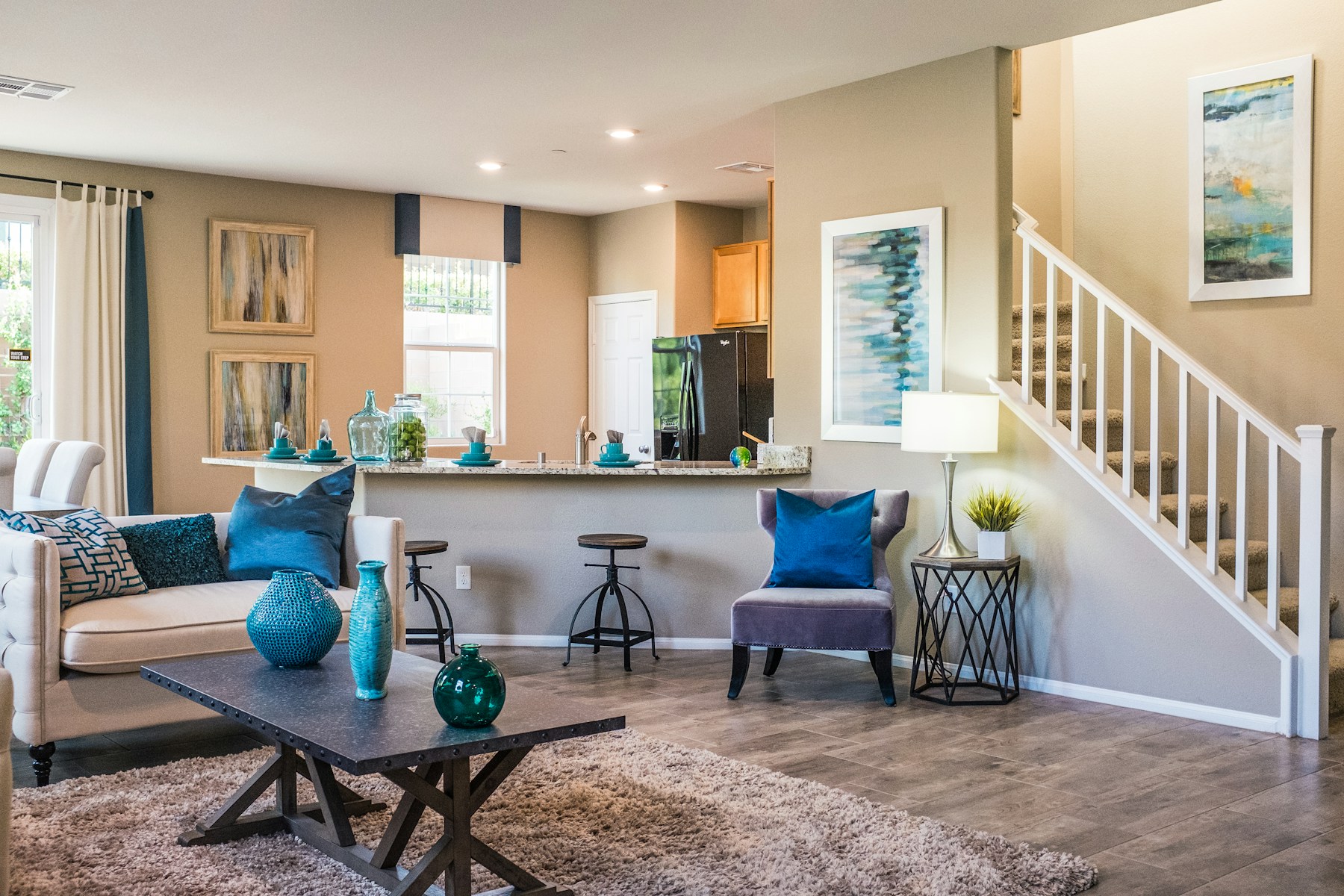 Stay living-room interior with kitchen bar, no faces