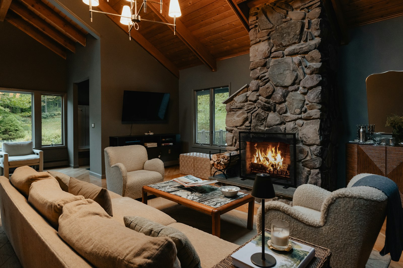 Cabin living room with stone fireplace, no faces
