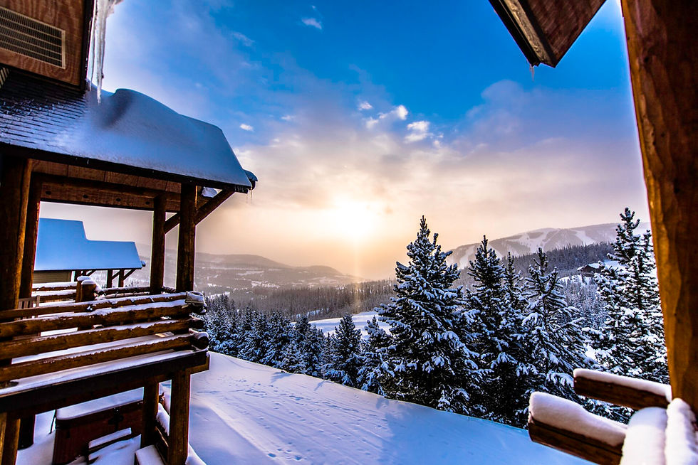 Sunrise over snowy pines and ridgelines at Big Sky Montana, no people