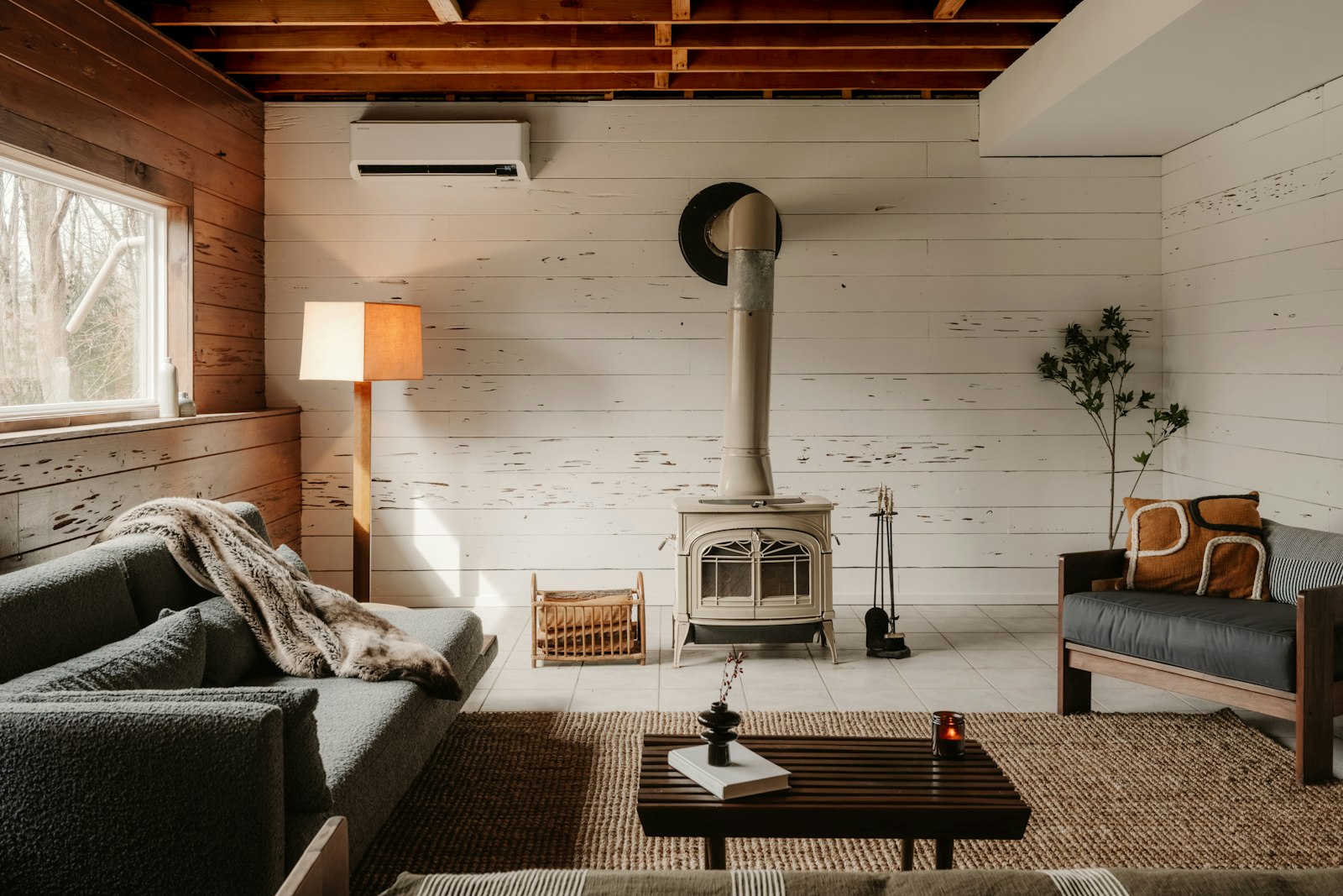 Cabin living room with wood stove, no faces