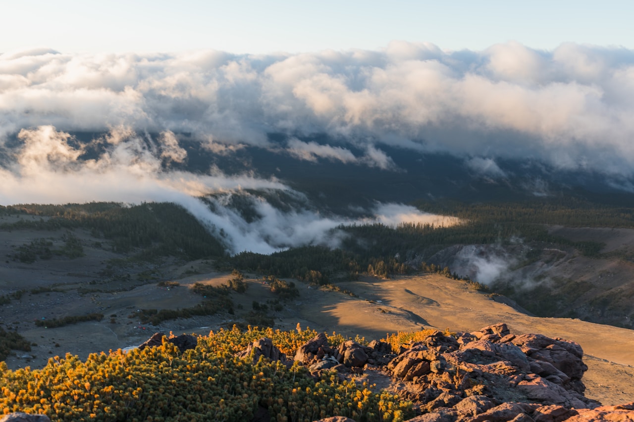 Clouds filling a valley below the Mount Shasta high country