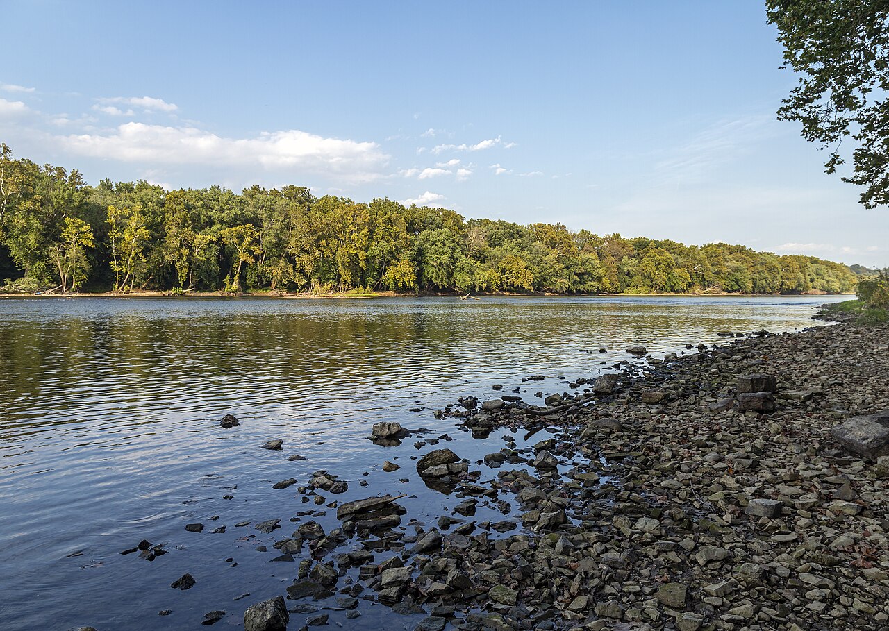 A rocky Potomac shoreline and wooded far bank at Pack Horse Ford in Jefferson County, West Virginia.