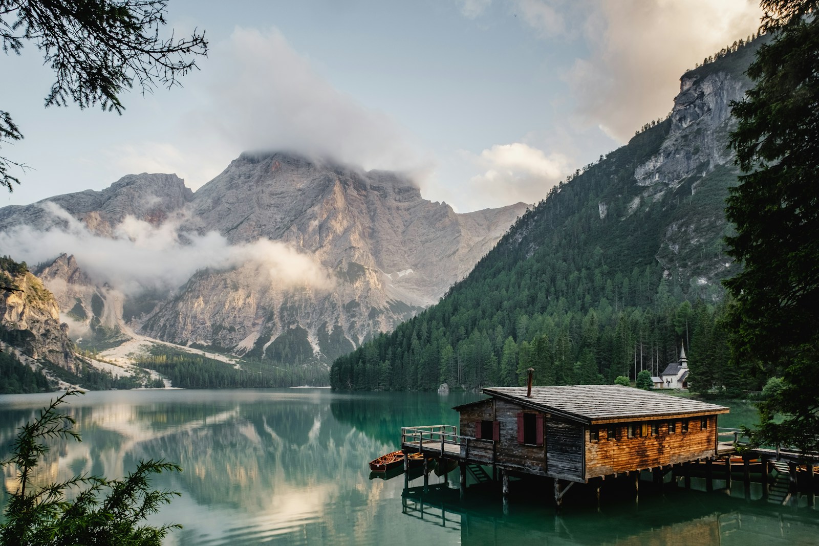 Wood boathouse on a mountain lake, no people
