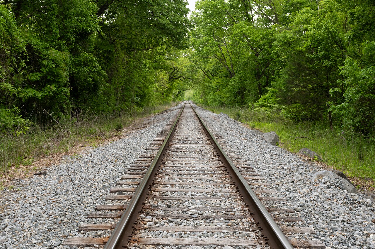 Railroad tracks through woods on the approach to Harpers Ferry in Jefferson County, West Virginia.