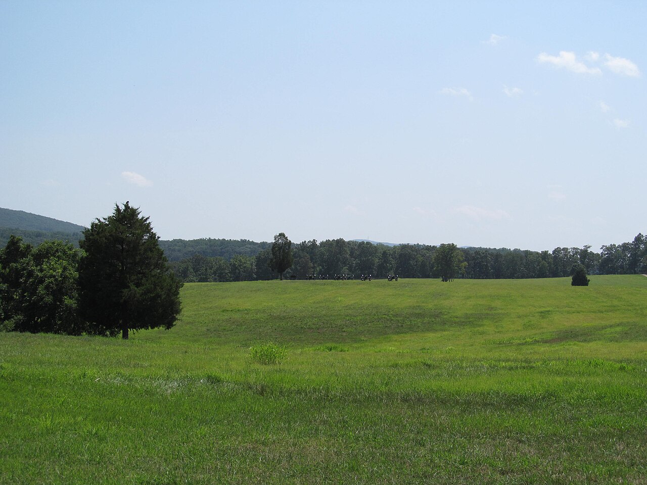 Open meadow and distant ridge on a Jefferson County battlefield field in West Virginia.