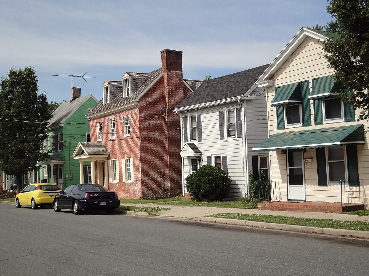 A row of historic houses along a residential street in Easton, Maryland.
