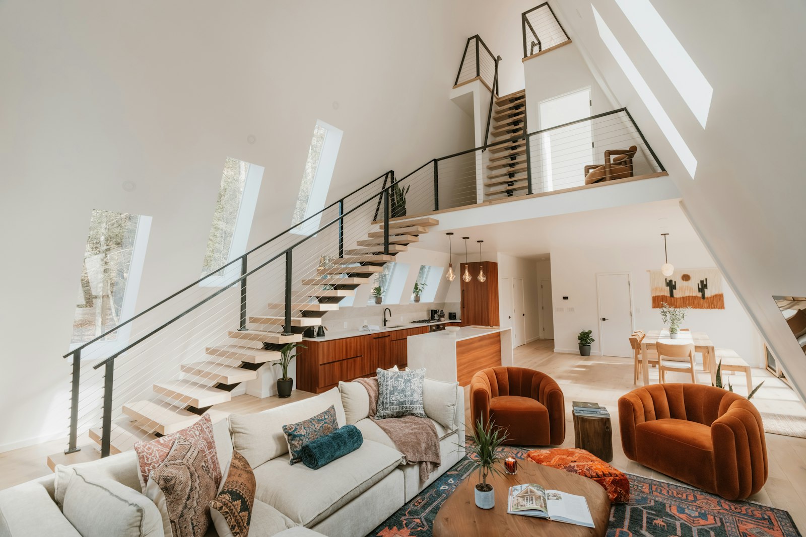 A-frame short-term rental loft with an open kitchen and living room