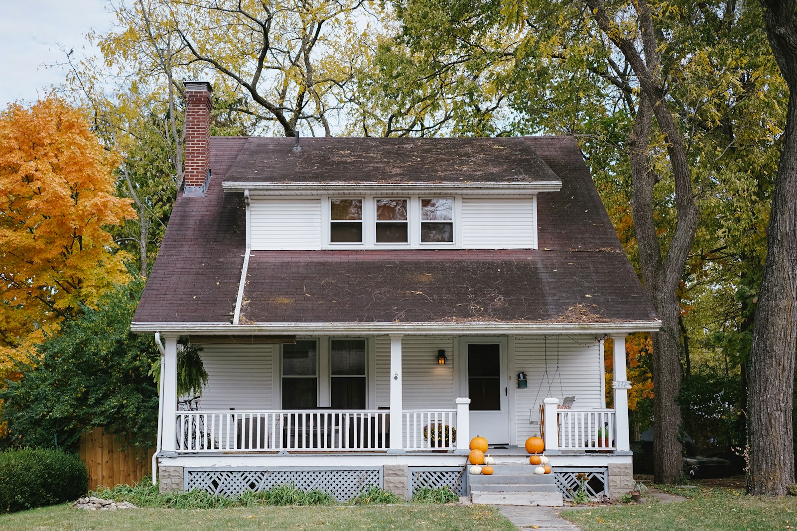 White porch house in autumn, no faces