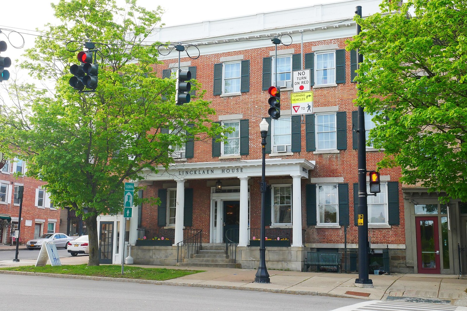 Brick inn on a town street, no faces