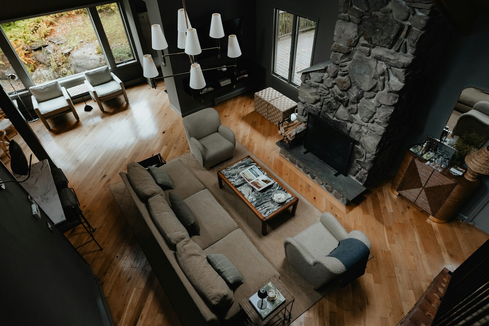 Overhead view of a vacation-home living room with a stone fireplace