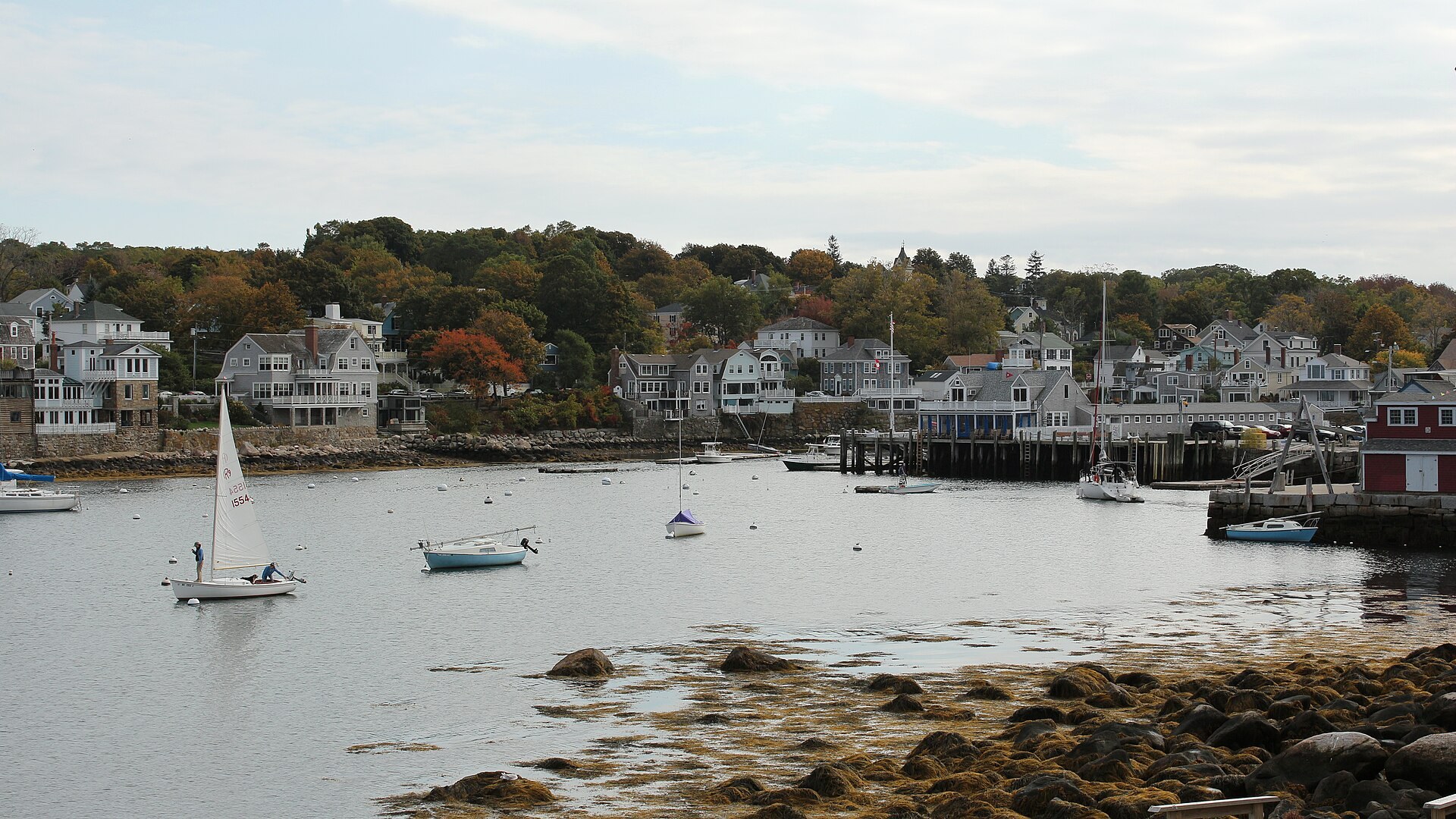 Rockport Harbor with village houses and a sailboat, Cape Ann