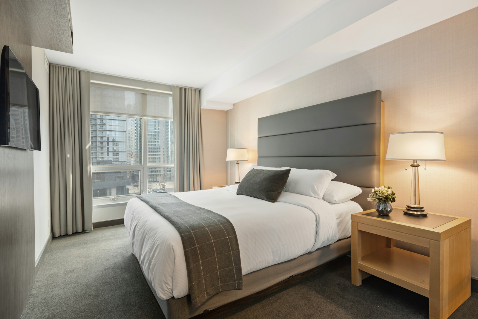 Stay bedroom with city window, no faces