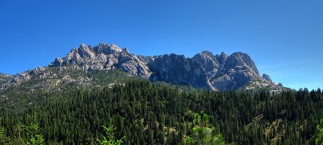Castle Crags above pine forest under a clear June sky