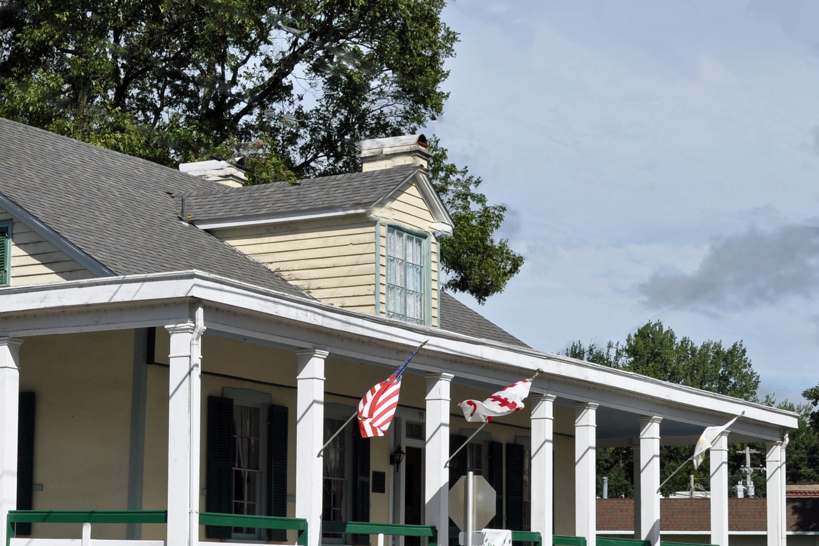 Porch house roofline and flags, no faces