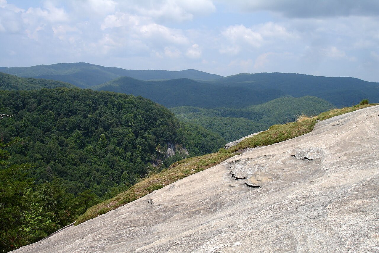 Granite slab and forested ridges at Table Rock State Park, South Carolina.