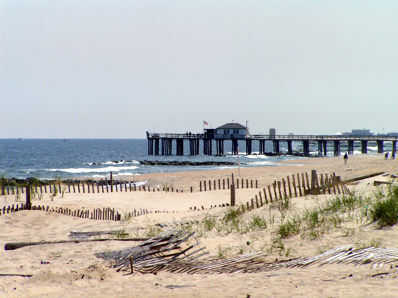 Ocean Grove fishing pier beyond the dunes