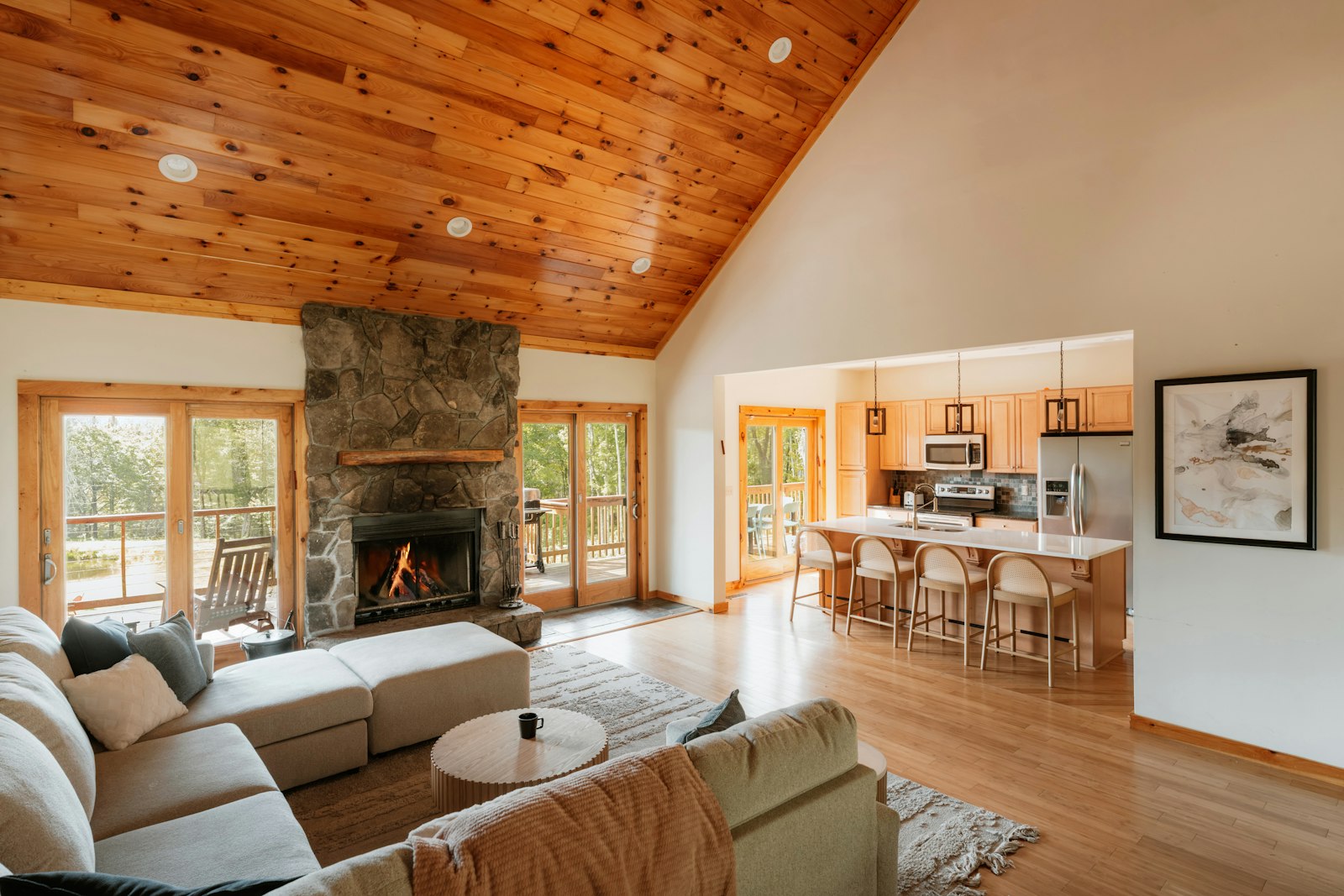Cabin living room, fireplace, and kitchen, no faces