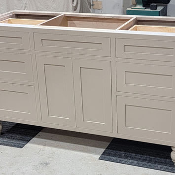 Custom shaker vanity with turned bun feet and inset doors and drawers