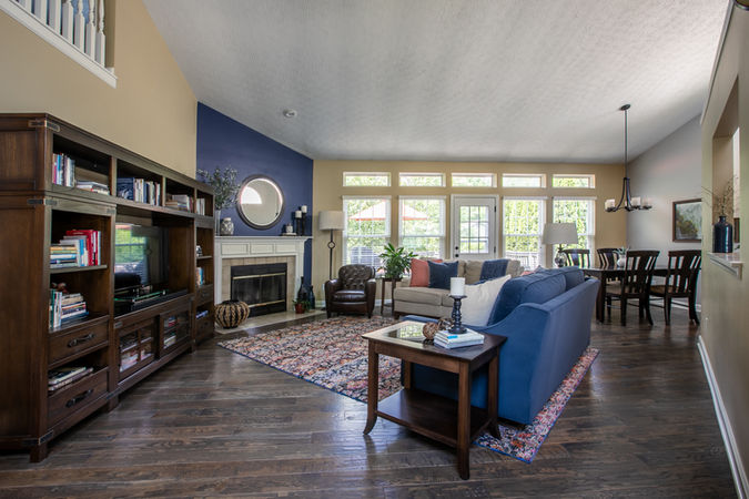 bookshelf, entertainment, rug, fireplace, round mirror, decor, chair, couch
