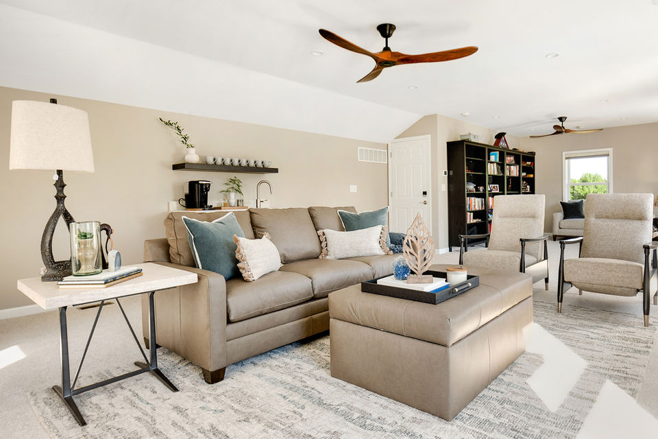 couch, ottoman, bar, fan, rug