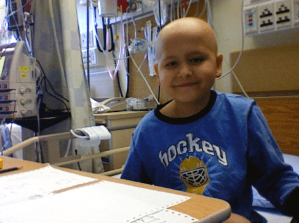 Ben receiving high-dose chemo, still with a smile.