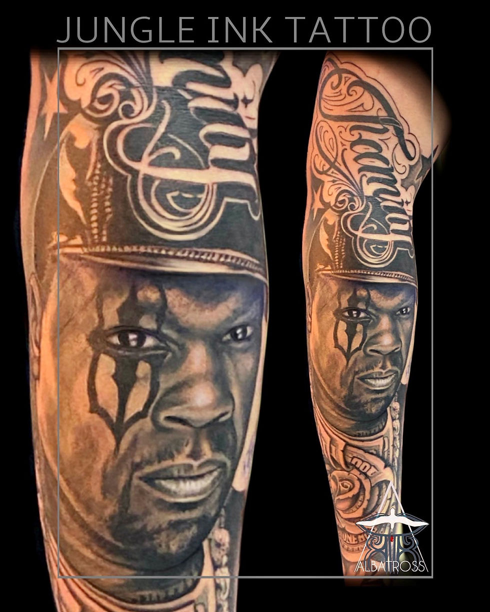 Black and grey portrait sleeve tattoo featuring realistic male face and lettering by Jungle Ink Tatt